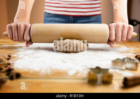 Young woman baking Christmas cookies at home Stock Photo