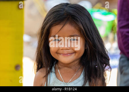 Don Khone, Laos - April 23, 2018: Portrait of a girl posing and smiling in a remote village of southern Laos Stock Photo