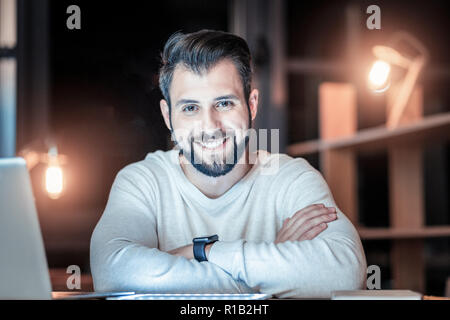 Joyful male person posing on camera Stock Photo