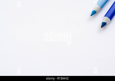 Two blue pencils isolated on white background. Stock Photo