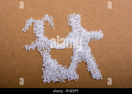Married man and woman figure formed with white small stones Stock Photo