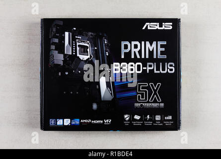 Maykop, Russia - November 9, 2018: Asus Prime motherboard in box on grey background closeup top view Stock Photo