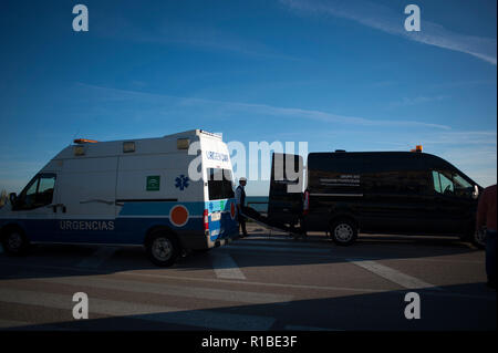 (EDITOR'S NOTE: IMAGE DEPICTS DEATH). A corpse of a migrant seen carried into a mortuary van after arriving on the beach on a dinghy with a group of migrants. A dinghy with migrants and two dead arrived at the Chilches beach near the coast of Velez Málaga, in Malaga. According to the media and witnesses, some of the migrants from Morocco escaped at the beach while the two corpses were found inside the small boat. Stock Photo