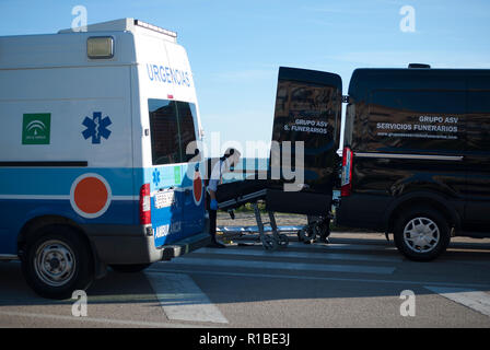 (EDITOR'S NOTE: IMAGE DEPICTS DEATH). A corpse of a migrant seen carried into a mortuary van after arriving on the beach on a dinghy with a group of migrants. A dinghy with migrants and two dead arrived at the Chilches beach near the coast of Velez Málaga, in Malaga. According to the media and witnesses, some of the migrants from Morocco escaped at the beach while the two corpses were found inside the small boat. Stock Photo