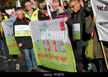 Wurzburg, Bavaria, Germany. 11th Nov, 2018. Staff members of Diakonie and the Protestant Church protested on the fringes of the annual conference of the Synod of the Protestant Church in Germany (EKD). They protested against a draft amendment to the Employee Representation Act of the EKD. Photo: Daniel Karmann/dpa Credit: dpa picture alliance/Alamy Live News Stock Photo