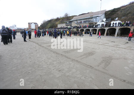 Folkestone, Kent, UK. 11th Nov, 2018. Members of the public joined in using stencils to make 100 outlines of lifes lost in the Wars, at Folkestone, Kent, on November 11th, 2018, marking the Armistice Centenary Credit: Monica Wells/Alamy Live News Stock Photo