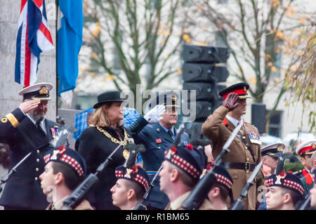 Glasgow, Scotland, UK. 11th November, 2018. The Lord Provost of Glasgow Eva Bolander together with senior Military Personnel salute the parade during a Remembrance Sunday service at the Cenotaph in George Square on the 100th anniversary of the signing of the Armistice which marked the end of the First World War. Credit: Skully/Alamy Live News Stock Photo