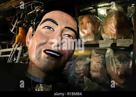 Angono, Rizal, Philippines. 11th Nov, 2018. Before the Higantes Festival, where they parade giant puppets, there is this artisan who creates them. Arturo ''Totie'' Arcana is best known for creating these giant puppets that continues to live the tradition of parading them during the month of November.Higantes Festival started a century ago during the Spanish colonization. It was from Mexico that these caricatures was influenced. The larger than life caricatures are a form of protest to corrupt Spanish lords that became tradition in Agnono. Giant heads of Philippine presidents are store Stock Photo