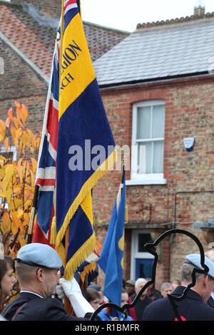 100 Years Armistice Remembrance Day Ceremony in Easingwold Market Square, North Yorkshire, England, UK. A remembrance service held every year in the North Yorkshire Market Town and attended by local groups and the general public. Despite the rain this year the Armistice service was very well supported to commemorate 100 years since the end of World War 1. Stock Photo