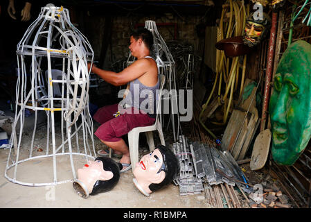 Angono, Rizal, Philippines. 11th Nov, 2018. Before the Higantes Festival, where they parade giant puppets, there is this artisan who creates them. Arturo ''Totie'' Arcana is best known for creating these giant puppets that continues to live the tradition of parading them during the month of November.Totie has been doing this since he was a teenager. This has become his past time but because of his great skill and art in making these giants he is in demand.Today he is using recycled materials because the low budget given to him for the festival. The Higantes body used to be made out of Stock Photo