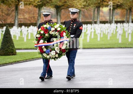 U.S Marines present a wreath during a ceremony at the Aisne - Marne American Cemetery near the World War One battle ground of Belleau Wood November 10, 2018 in Belleau, France. President Donald Trump was scheduled to attend the ceremony but cancelled due to inclement weather. Stock Photo