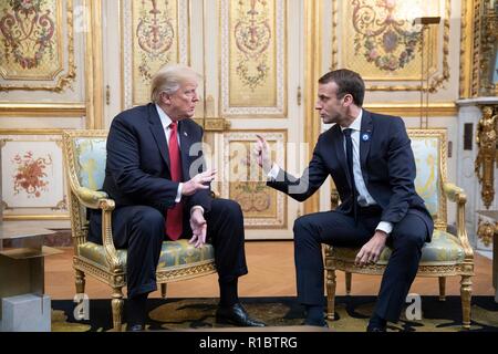 U.S President Donald Trump, left, during a bilateral meeting with French President Emmanuel Macron at the Elysee Palace November 10, 2018 in Paris, France. Trump is in France for commemorations marking the Centennial of the end of World War I. Stock Photo