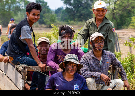 Don Khone, Laos - April 23, 2018: Masked agricultural workers transported on a truck in the southernmost province of Laos Stock Photo