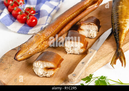 Smoked eel ready to eat. Delicious freshly made seafood. Stock Photo