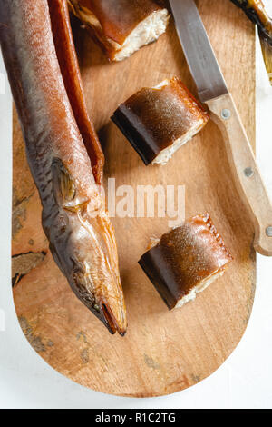 Smoked eel ready to eat. Delicious freshly made seafood. Stock Photo