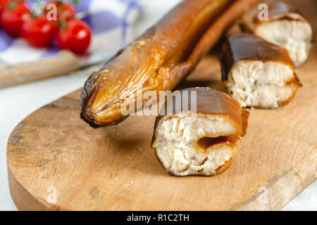 Smoked eel ready to eat. Delicious freshly made seafood. Stock Photo