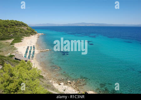 View from the hill on the sandy beach and crystal clear turquoise sea, Halkidiki peninsula, Greece. Stock Photo