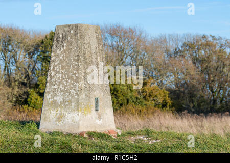 Stone Triangulation Pillar or Trig Point, OSBM S4011 at Highdown Hill in West Sussex, England, UK. Ordnance survey bench mark. Stock Photo
