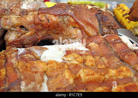 Texture and pattern of roasted pig meat. Swine skin roasted on a grill. Baked Pig meat background pattern. Carnivorous. Christmas happy holidays Stock Photo