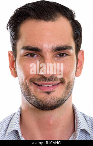 Face of happy young handsome businessman smiling Stock Photo