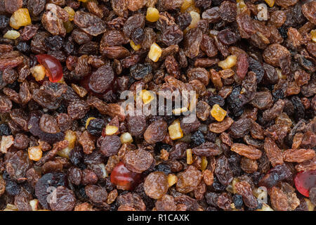 dried fruits soaking in alcohol for christmas fruitcake Stock Photo