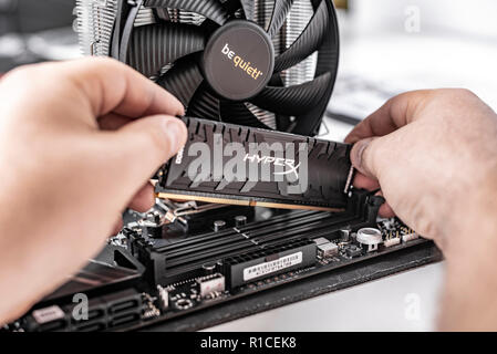 Installing random access memory into PC. Stock Photo