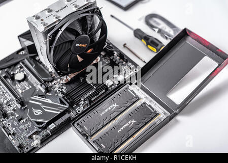 Motherboard, with installed cooler and RAM. Build a PC. Stock Photo