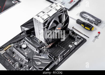 Motherboard, with installed cooler and RAM. Build a PC. Stock Photo
