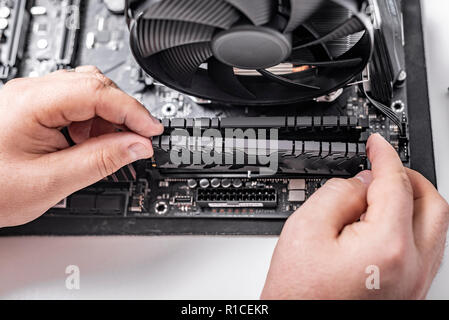 Installing random access memory into PC. Stock Photo