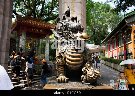Sculpture stone Qilin dragon guardian at entrance of Wong Tai Sin Temple for people visit and respect praying at Kowloon on September 9, 2018 in Hong  Stock Photo