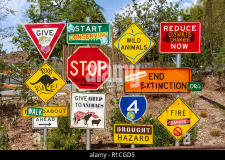 Road traffic signs adapted with environmentally friendly messages, San Diego Zoo Safari Park, Escondido, CA, United States, Stock Photo