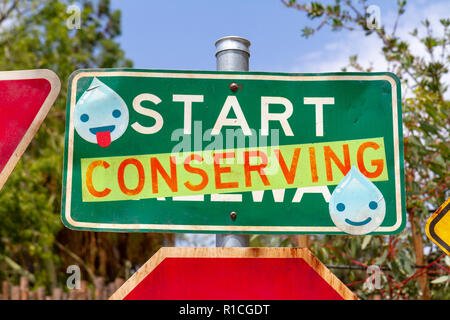 Road traffic sign adapted with environmentally friendly message, San Diego Zoo Safari Park, Escondido, CA, United States, Stock Photo