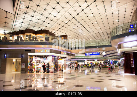 Chinese and foreigner travelers walking in terminal 2 of Hong Kong International Airport or Chek Lap Kok Airport on September 10, 2018 in Hong Kong, M Stock Photo