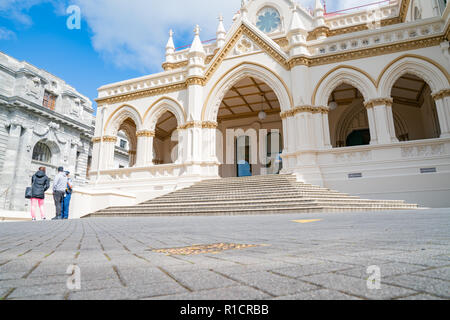 WELLINGTON, NEW ZEALAND - OCTOBER 2 2018; people outside Parliamentary Library Gothic Revival style building one of New Zealand Government buildings o Stock Photo