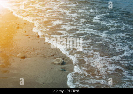 Stone beach with waves. Multi colore stones on beach Stock Photo