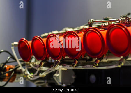 Red pipes on sport engine throttles Stock Photo