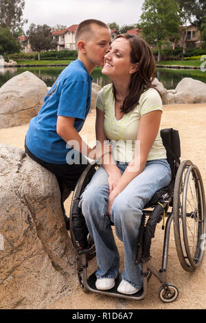 Son kissing cheek of disabled Mother in wheelchair   © Myrleen Pearson  ...Ferguson Cate Stock Photo