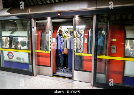 London England,UK,South Bank,Southwark Underground Station train Tube tube subway Jubilee Line,platform,train,passenger passengers rider riders,commut Stock Photo