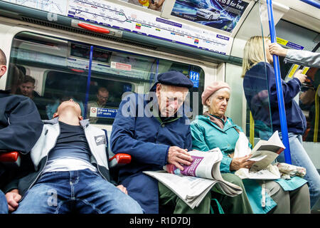 London England,UK Soho,Piccadilly Circus Underground Station train Tube,subway tube,train,inside interior,man men male,woman female women,boy boys,kid Stock Photo