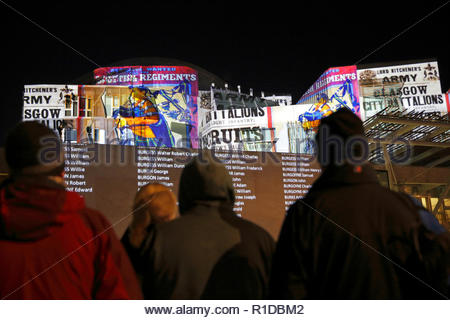 Edinburgh, United Kingdom. 11th November, 2018.  The Scottish Parliament building illuminated on Armistice day with images that tell the story of the world war 1 conflict alongside a Roll of Honour of those who died.   Credit: Craig Brown/Alamy Live News. Stock Photo
