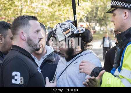 London, UK. 21st Oct, 2018. Police are forced to separate speakers to avoid a disturbance at Speakers Corner in London. Credit: Edward Crawford/SOPA Images/ZUMA Wire/Alamy Live News Stock Photo