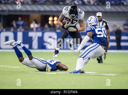 Indianapolis, Indiana, USA. 11th Nov, 2018. Jacksonville Jaguars tight end James O'Shaughnessy (80) runs with the ball after the catch as Indianapolis Colts defenders pursue during NFL football game action between the Jacksonville Jaguars and the Indianapolis Colts at Lucas Oil Stadium in Indianapolis, Indiana. Indianapolis defeated Jacksonville 29-26. John Mersits/CSM/Alamy Live News Stock Photo