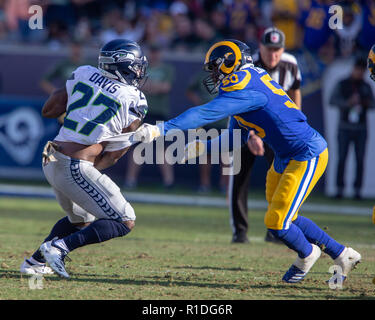 Los Angeles, CA, USA. 11th Nov, 2018. Seattle Seahawks outside linebacker  Shaquem Griffin (49) and Seattle Seahawks cornerback Shaquill Griffin (26)  hold up Los Angeles Rams defensive end Dante Fowler (56) jersey