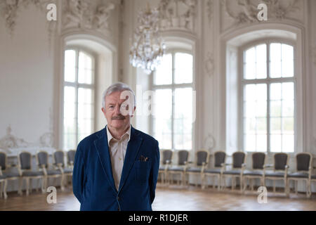 Rundale, Latvia. 26th Aug, 2018. The art historian and long-time castle director Imants Lancmanis stands in Rundale Castle in the White Hall. The Latvian art historian Imants Lancmanis has dedicated more than 50 years of his life to the restoration of the largest baroque castle in the Baltic States. Now the lord of the castle is retiring. (to dpa-KORR.: 'Enough renovated: lord of the castle of the 'Latvian Versailles' retires' from 12.11.2018) Credit: Alexander Welscher/dpa/Alamy Live News Stock Photo