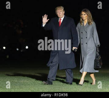 Washington, District of Columbia, USA. 11th Nov, 2018. United States President Donald J. Trump and first lady Melania Trump arrive back at the White House in Washington, DC after participating in events marking the 100th Anniversary of the World War I Armistice on Sunday, November 11, 2018 Credit: Chris Kleponis/CNP/ZUMA Wire/Alamy Live News Stock Photo