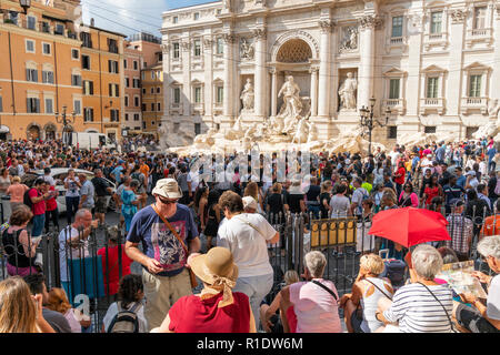 Hordes of tourists visiting the Trevi Fountain, one of the most popular tourist attractions in  Rome, Italy. Stock Photo