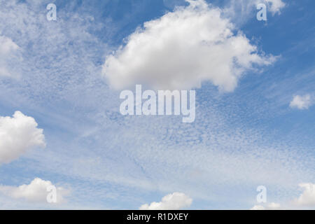 Beautiful white clouds and blue sky background over England UK. Fluffy and wispy cloudscape backdrop Stock Photo