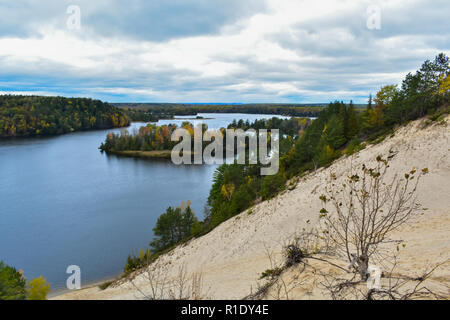 The big sand dunes at Lumbermans Monument. You can see the fall colors starting to show on the island below. This was taken in October of 2018. Stock Photo