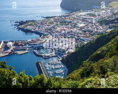 Image of city of Velas with habour on sao jorge with pico in the background Azores Portugal Europe Stock Photo