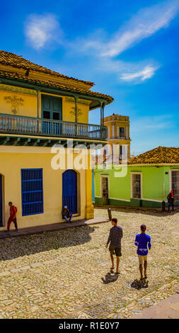 TRINIDAD, CUBA - MAY 25, 2014: Unidentified people on the street of Trinidad, Cuba. Trinidad has been a UNESCO World Heritage site since 1988. Stock Photo